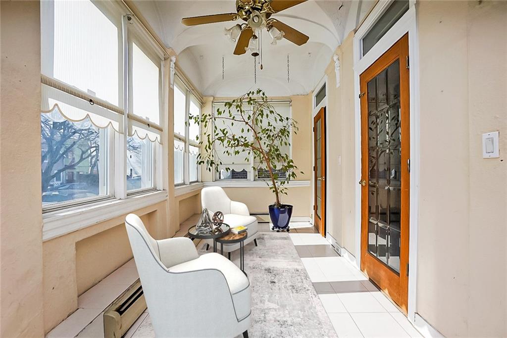 43 Reeve Place Brooklyn, NY 11218 - Photo 5 of 18 a living room with furniture and a chandelier