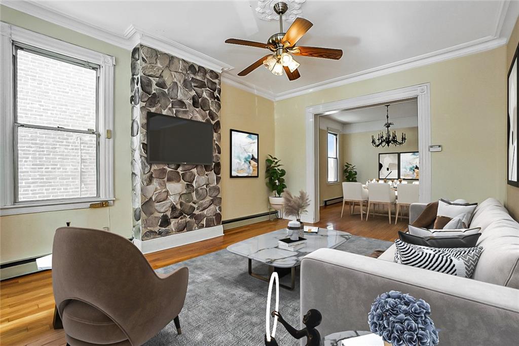 43 Reeve Place Brooklyn, NY 11218 - Photo 8 of 18 a living room with furniture potted plant and a window