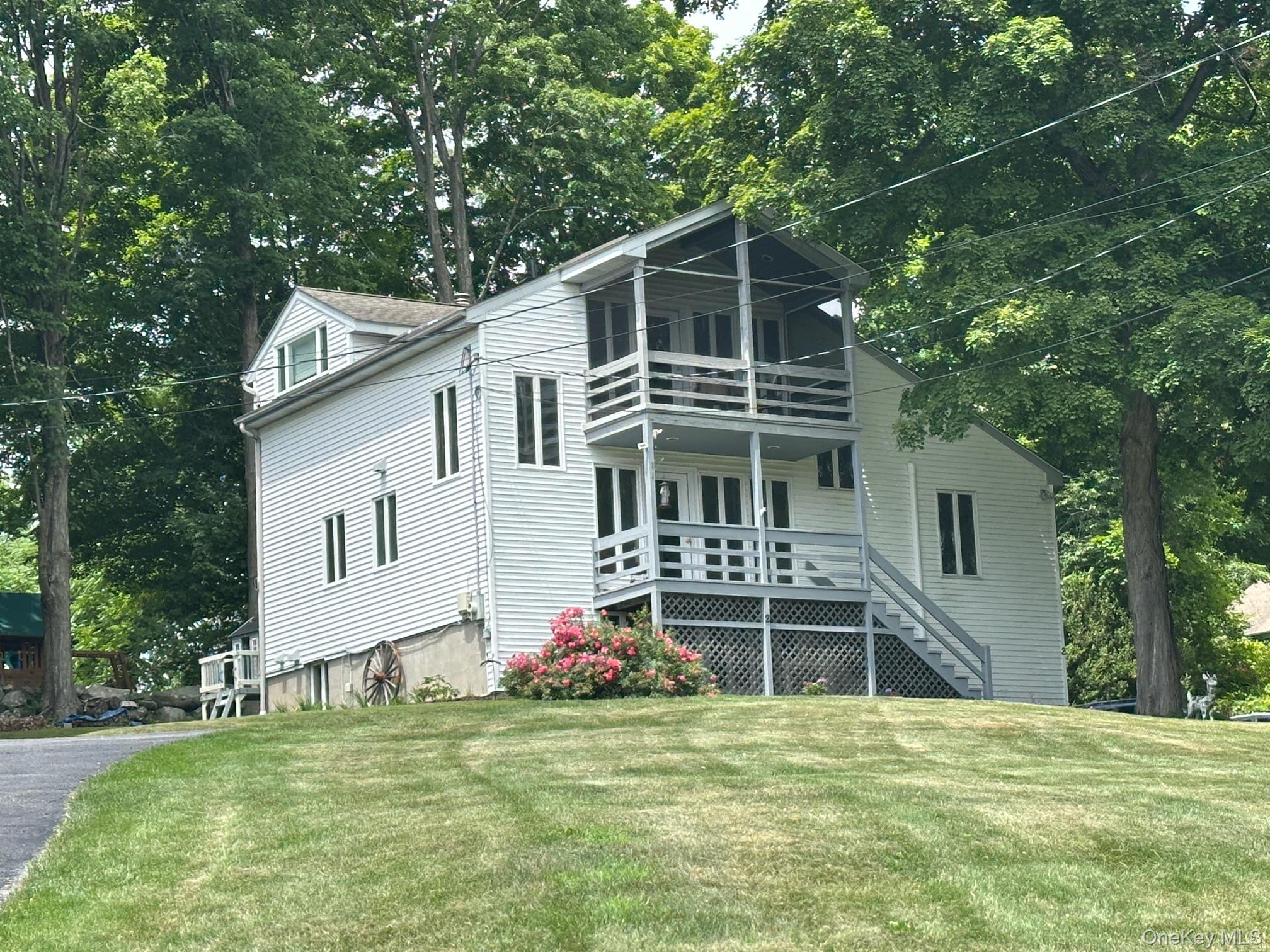 2 Fairview Road Mahopac, NY 10541 - Photo 1 of 1 a front view of a house with a garden