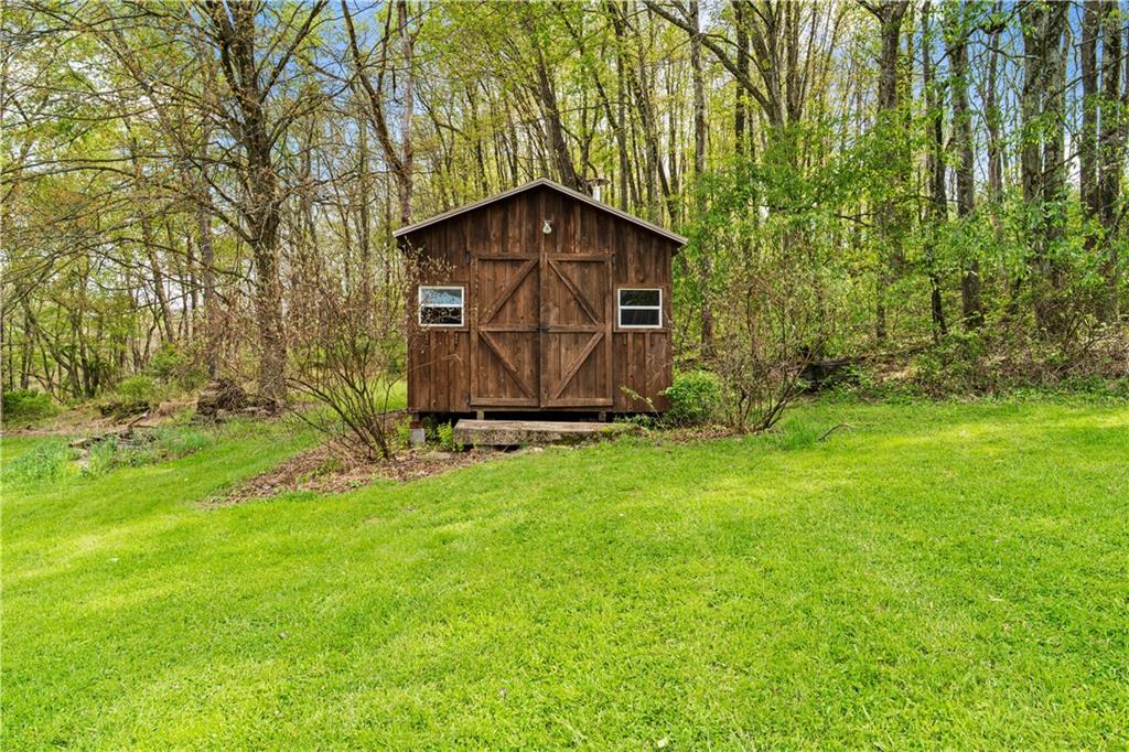 596 Wulfert Road Rochester Mills, PA 15771 - Photo 18 of 49 a wooden bench sitting in middle of the grass