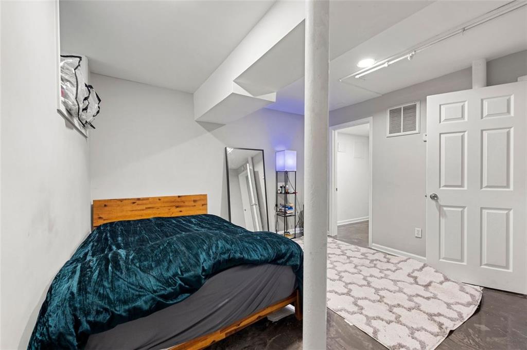 653 Somerset Terrace Northeast, Unit 3 Atlanta, GA 30306 - Photo 13 of 16 a bedroom with a bed and balcony view