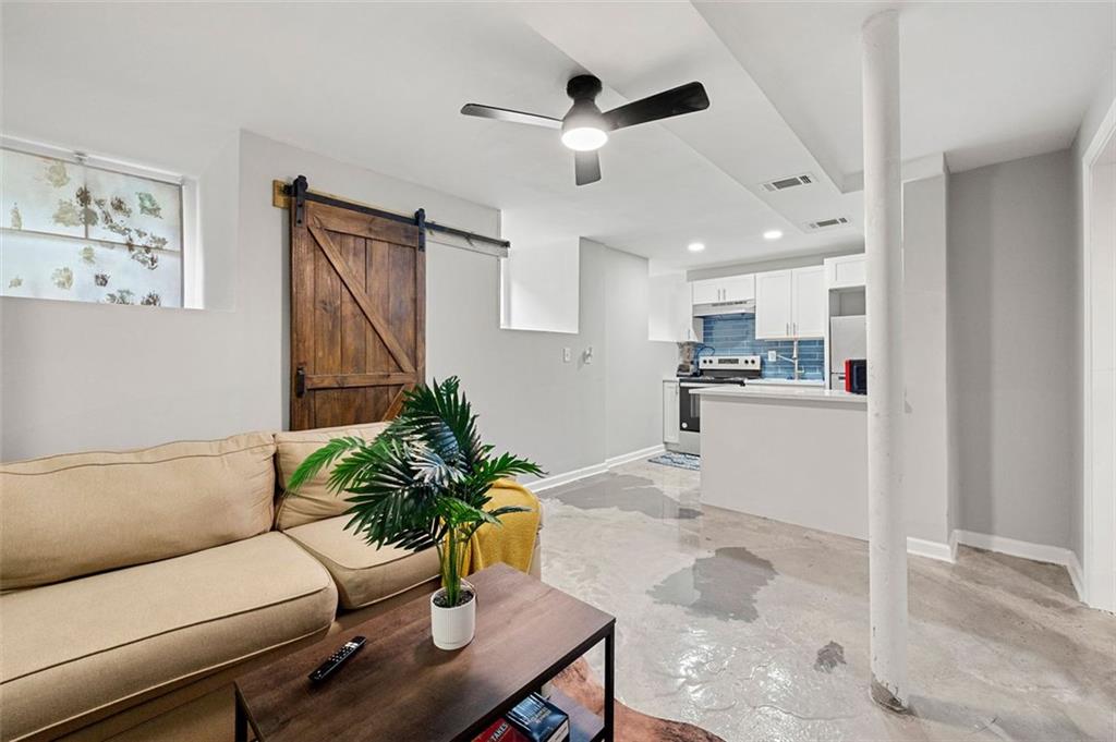 653 Somerset Terrace Northeast, Unit 3 Atlanta, GA 30306 - Photo 4 of 16 a living room with furniture and a potted plant