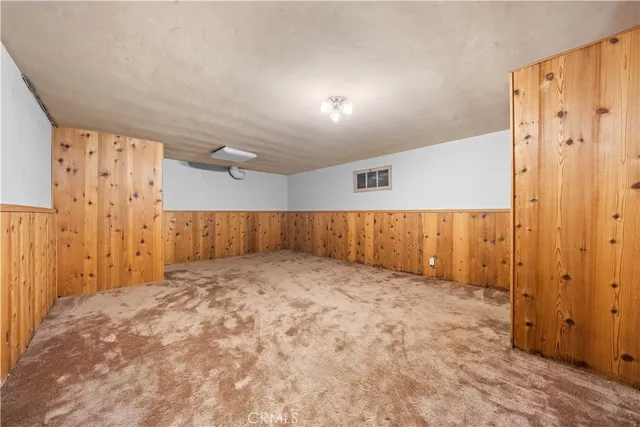 a view of house with yard and tree s