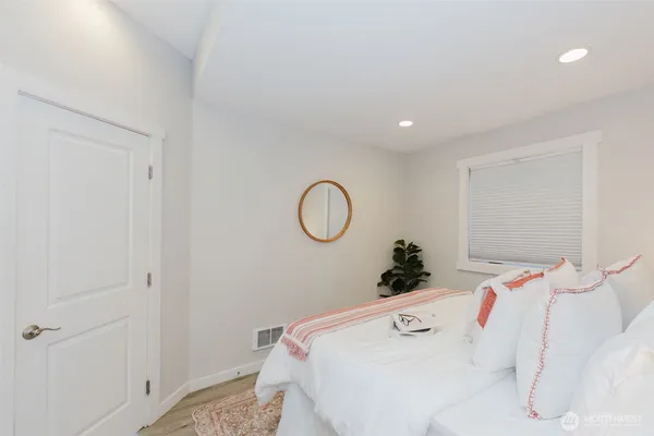 a spacious bathroom with 2 sink and a bathtub