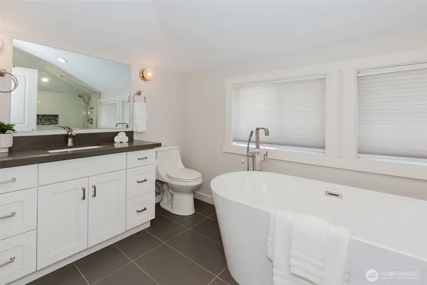 a bedroom with a bed and a view of bathroom
