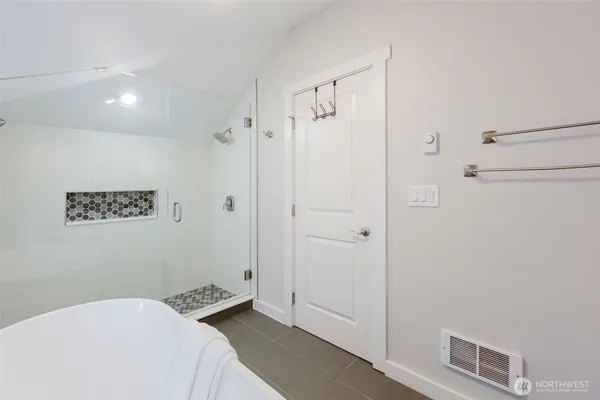 a workspace with furniture and lamp on dresser