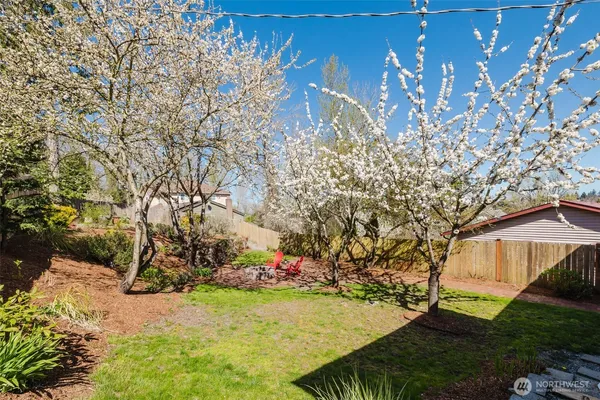 a view of a backyard with sitting area and furniture
