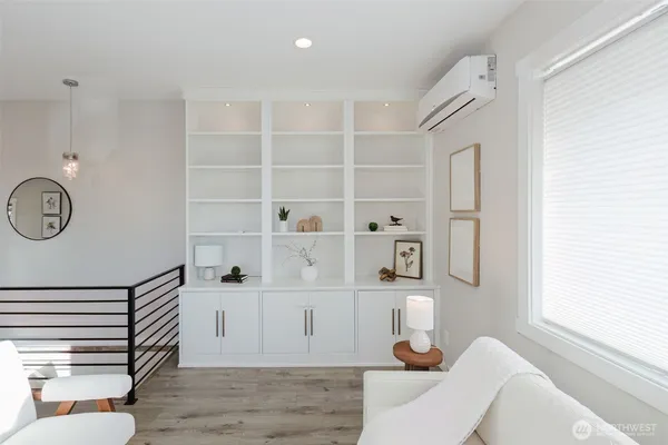 a living room with furniture and a rug