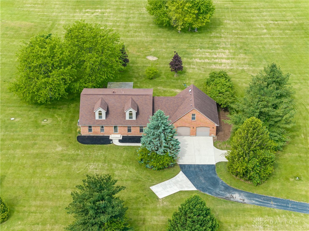9981 Ridge Acres Lane Englewood, OH 45322 - Photo 60 of 73 This captivating aerial view showcases a charming home nestled in expansive green surroundings.