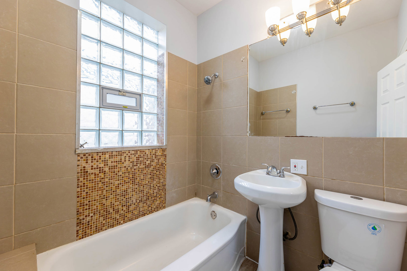 7427 South Perry Avenue Chicago, IL 60621 - Photo 10 of 19 a bathroom with a sink a toilet and shower