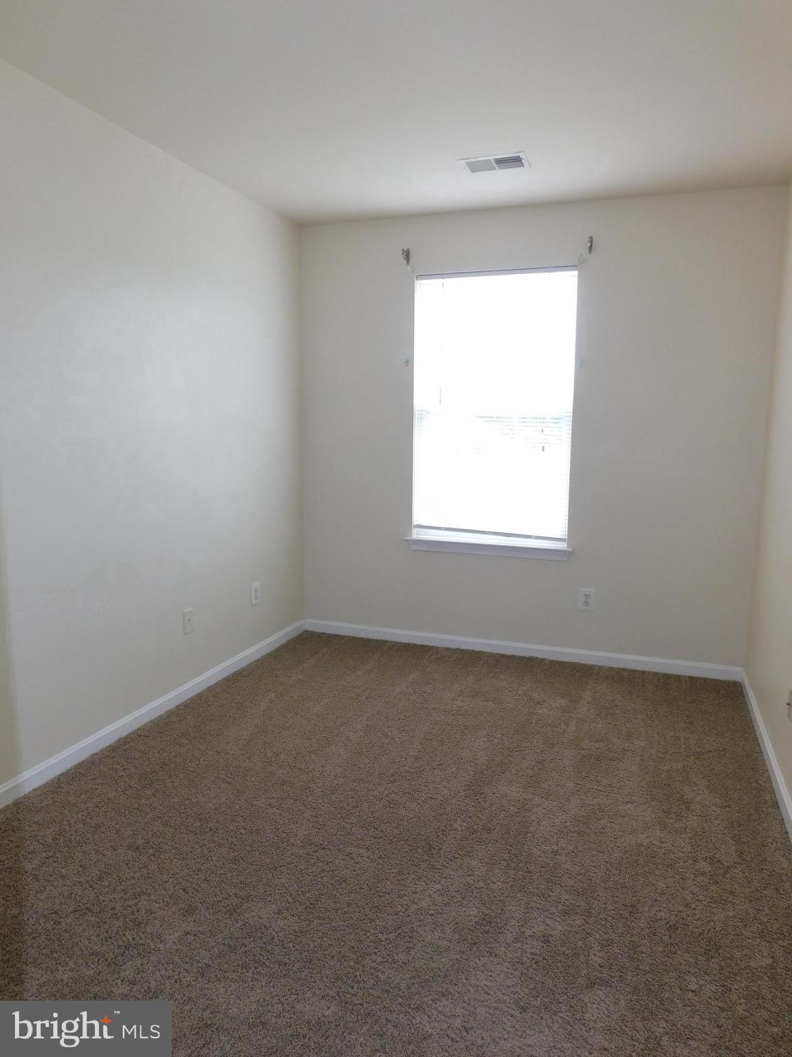 4036 Cutty Sark Road Baltimore, MD 21220 - Photo 22 of 25 an empty room with a window