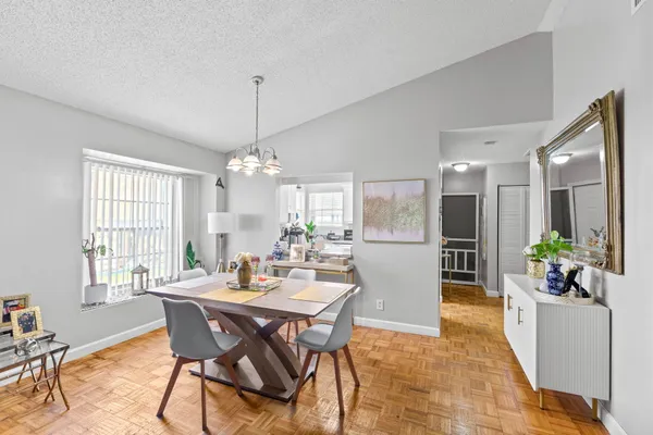 a view of a dining room with furniture and window