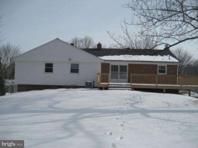 3725 Briars Road Olney, MD 20832 - Photo 2 of 12 a front view of a house with a yard and garage