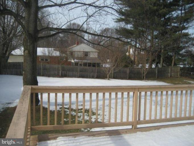 3725 Briars Road Olney, MD 20832 - Photo 3 of 12 a front view of a house with a wooden fence