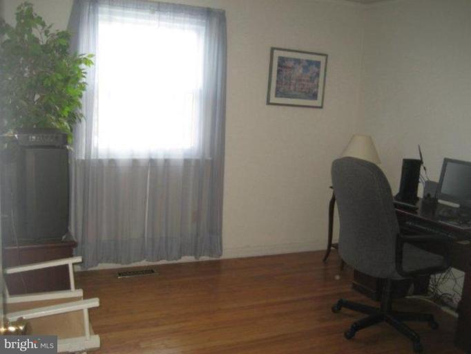 3725 Briars Road Olney, MD 20832 - Photo 7 of 12 a view of workspace with wooden floor and windows