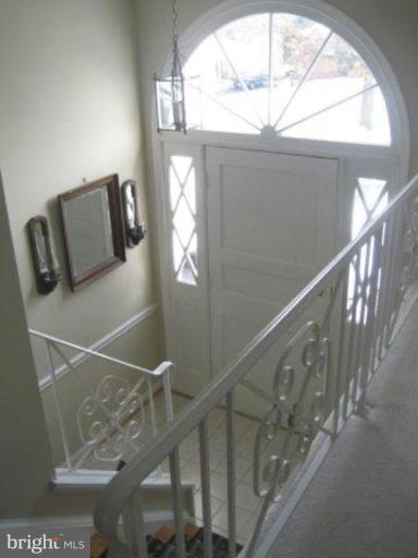 3725 Briars Road Olney, MD 20832 - Photo 8 of 12 a view of entryway and hall with wooden floor