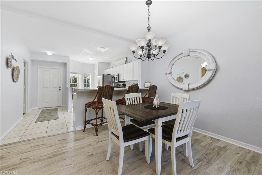 9175 Celeste Drive, Unit 204 Naples, FL 34113 - Photo 15 of 50 Coastal dining area and bar top