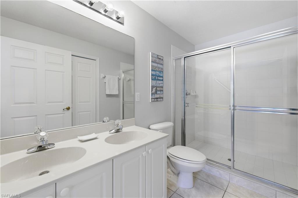 9175 Celeste Drive, Unit 204 Naples, FL 34113 - Photo 23 of 50 Double sink updated bathroom and shower