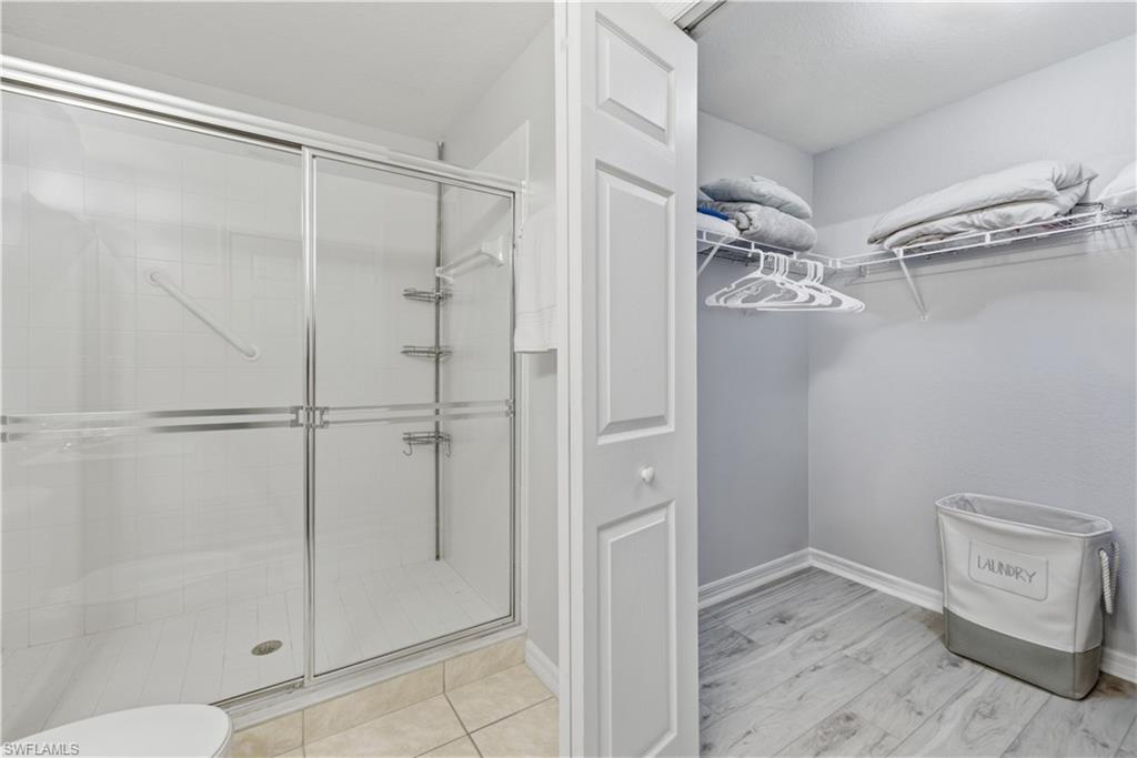 9175 Celeste Drive, Unit 204 Naples, FL 34113 - Photo 25 of 50 Spacious walk-in closet off the primary bathroom