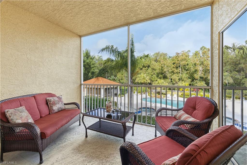 9175 Celeste Drive, Unit 204 Naples, FL 34113 - Photo 26 of 50 Enjoy views of the pool and preserve from your balcony lanai
