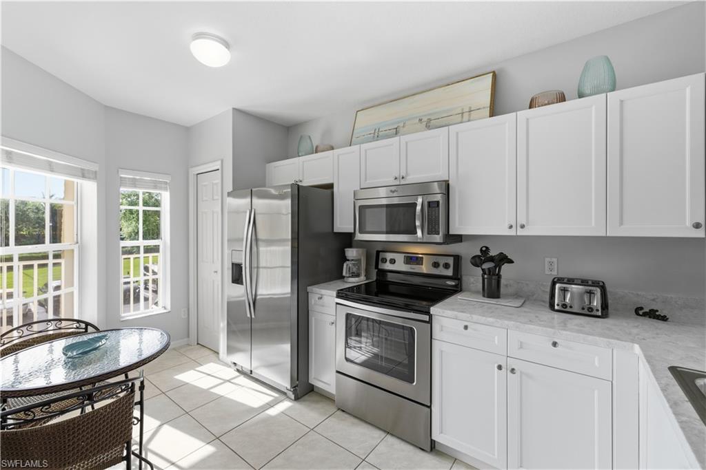 9175 Celeste Drive, Unit 204 Naples, FL 34113 - Photo 5 of 50 Kitchen filled with morning light