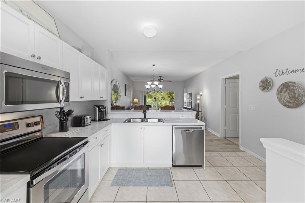 9175 Celeste Drive, Unit 204 Naples, FL 34113 - Photo 8 of 50 Kitchen looking into the home