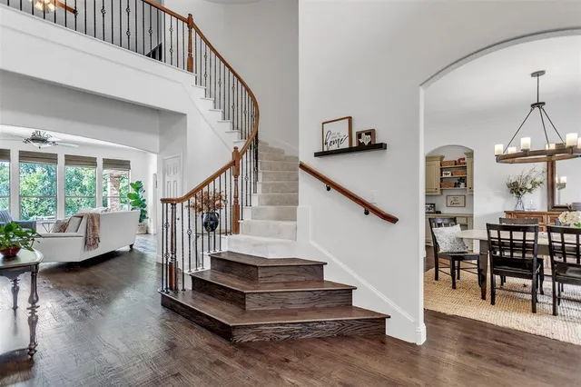 a view of entryway livingroom and hall with wooden floor