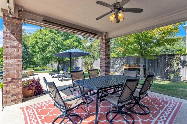 a view of a patio with a backyard table and chairs