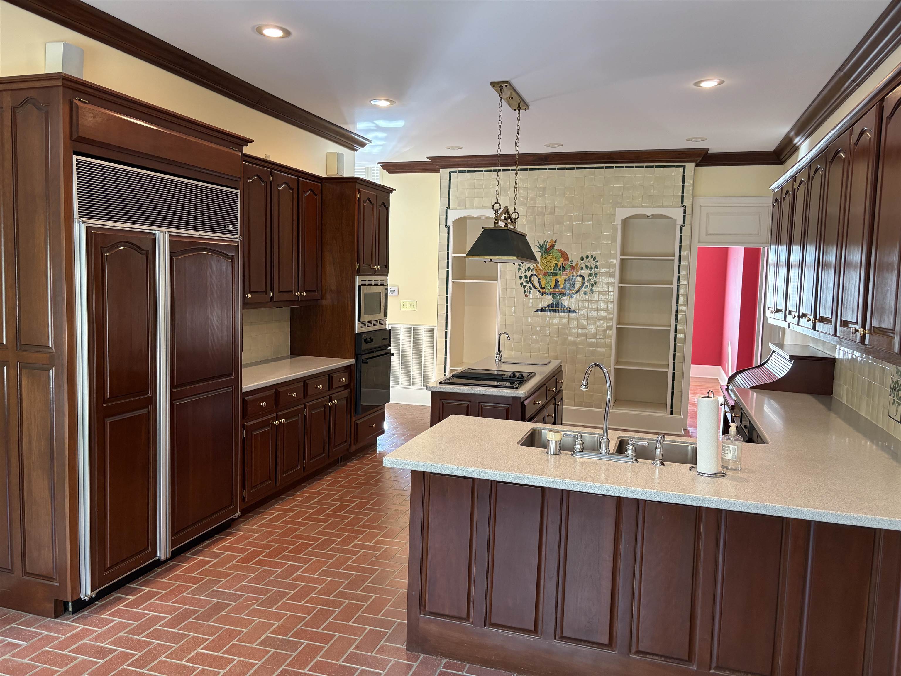 1200 Sand Ridge Bargerton Road Lexington, TN 38351 - Photo 11 of 40 a kitchen with stainless steel appliances a sink cabinets and wooden floor