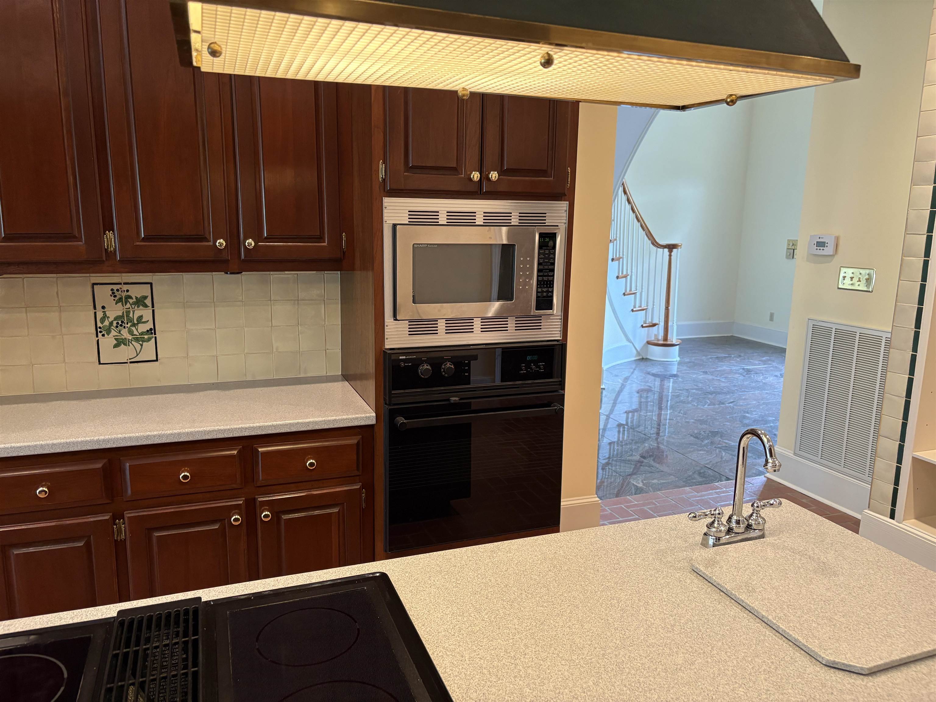 1200 Sand Ridge Bargerton Road Lexington, TN 38351 - Photo 18 of 40 a kitchen with a sink a stove and cabinets