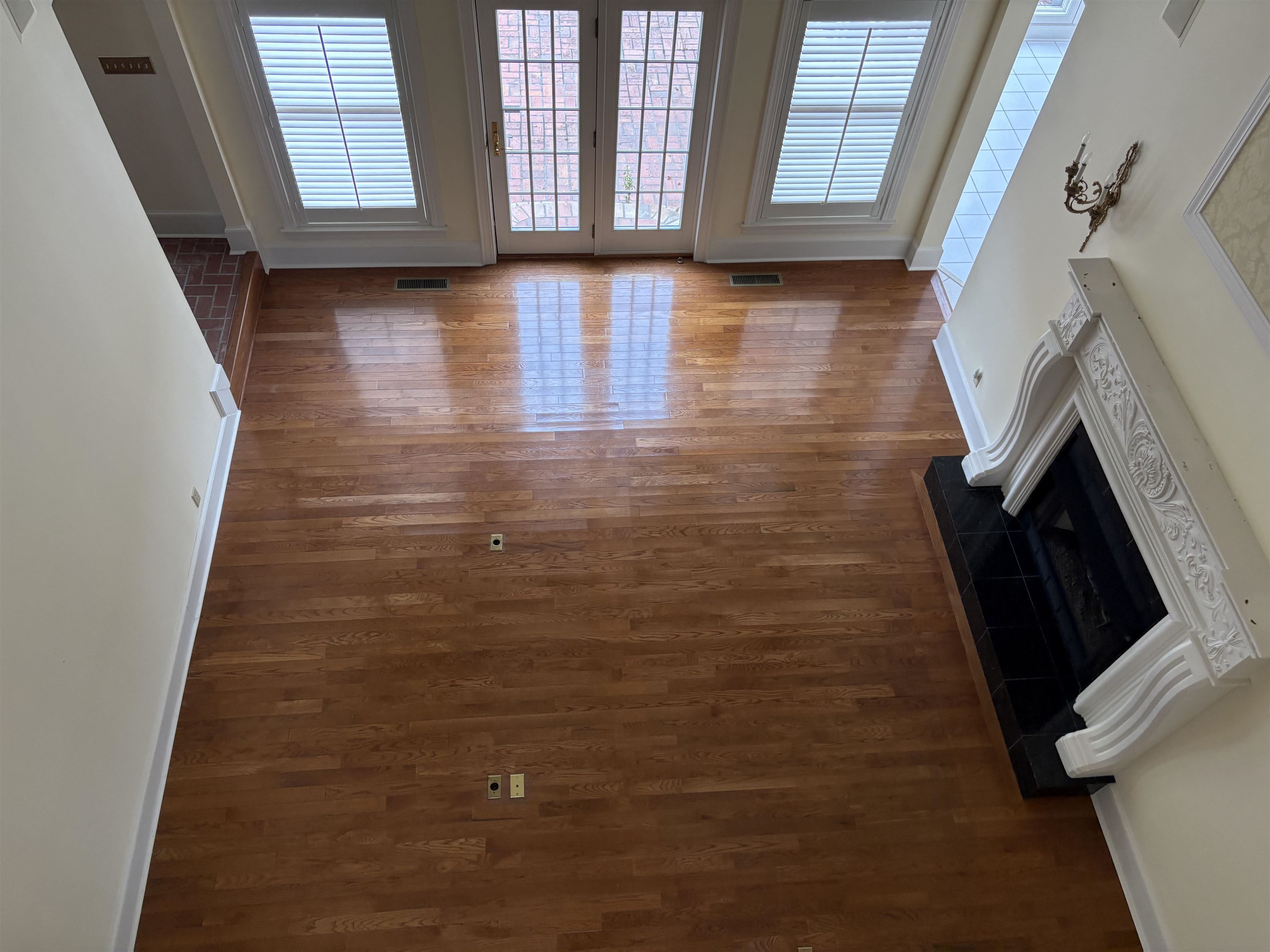 1200 Sand Ridge Bargerton Road Lexington, TN 38351 - Photo 7 of 40 a view of an empty room with wooden floor and a window