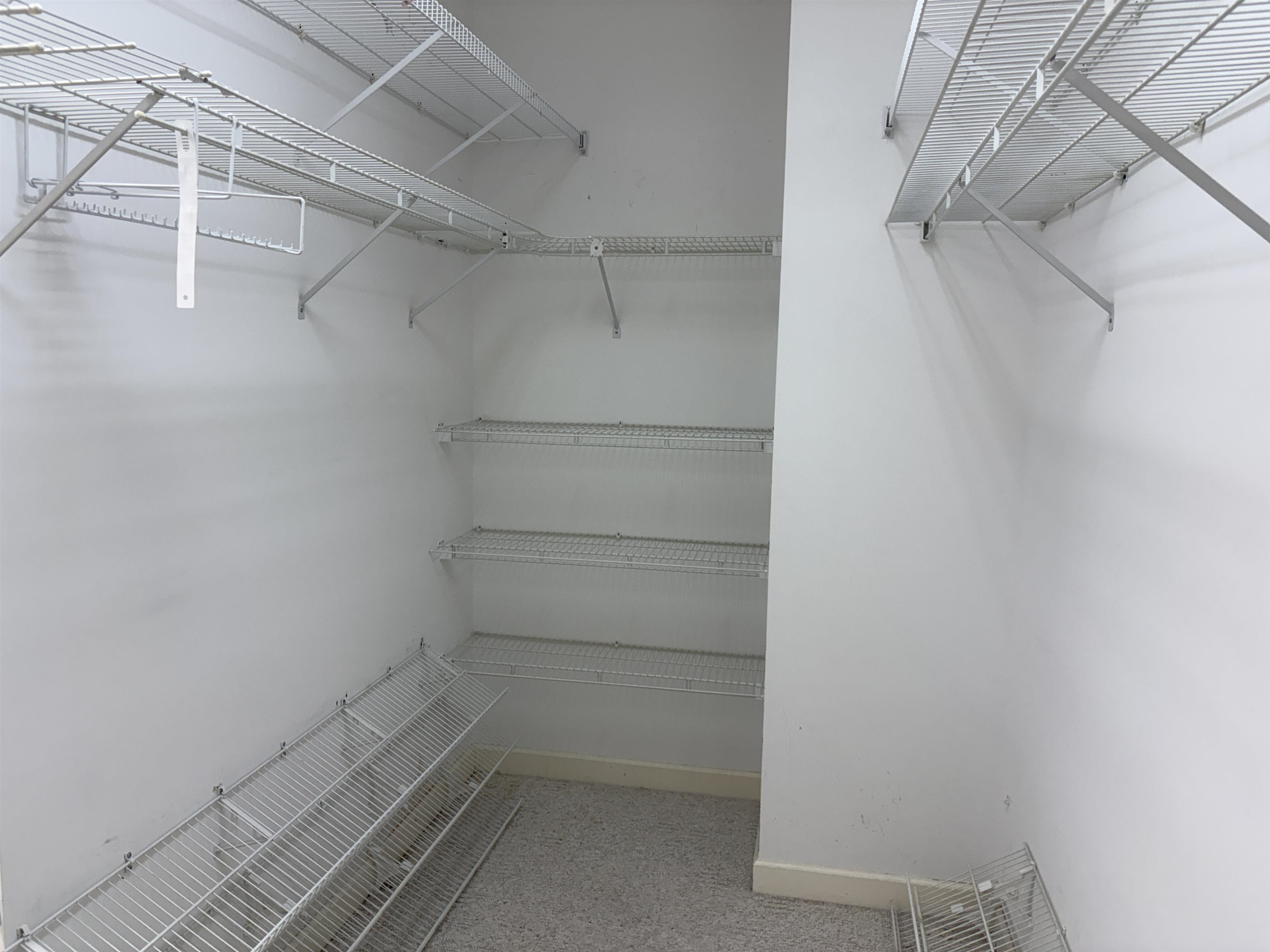 1200 Sand Ridge Bargerton Road Lexington, TN 38351 - Photo 8 of 40 a view of walk in closet with empty racks