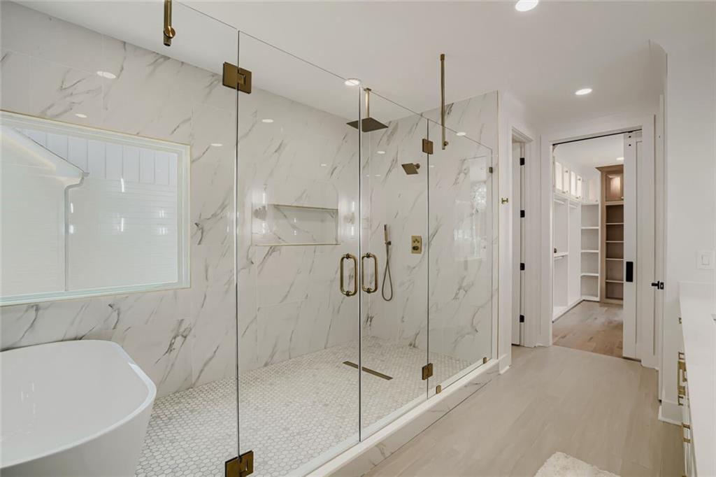 932 Cooper Road Loganville, GA 30052 - Photo 32 of 36 a bathroom with a shower and a sink