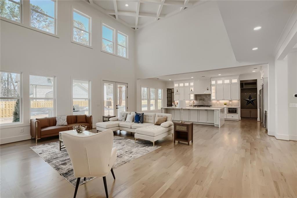 932 Cooper Road Loganville, GA 30052 - Photo 6 of 36 a living room with furniture wooden floor and a large window