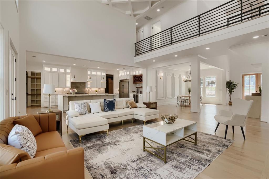 932 Cooper Road Loganville, GA 30052 - Photo 7 of 36 a living room with lots of furniture and view of kitchen