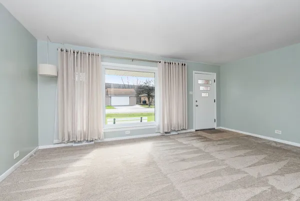 a view of an empty room and window