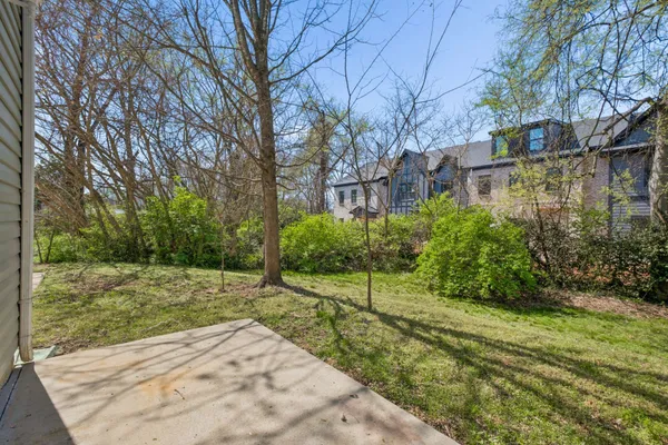a backyard of a house with lots of green space