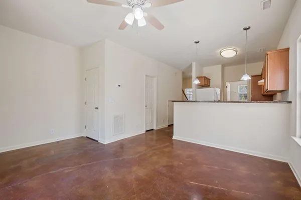 a view of a kitchen with a sink and a mirror