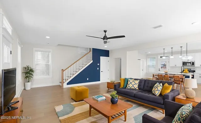 a living room with furniture and a flat screen tv