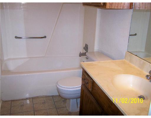 6717 Oakgate Drive Corpus Christi, TX 78413 - Photo 10 of 10 a bathroom with a sink and a toilet