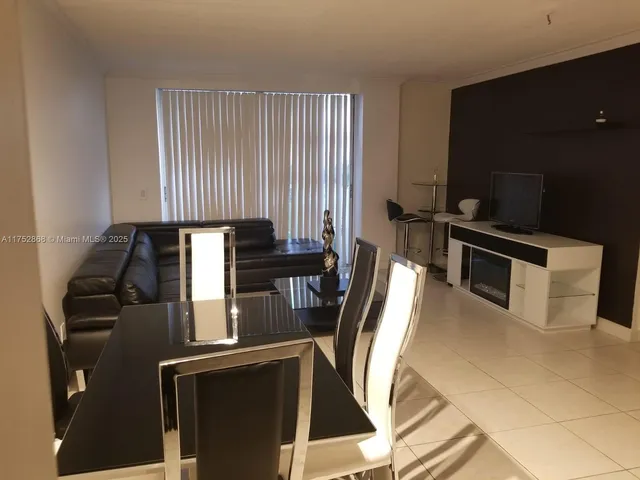 a kitchen with a sink appliances and cabinets