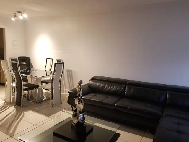a kitchen with a refrigerator and cabinets