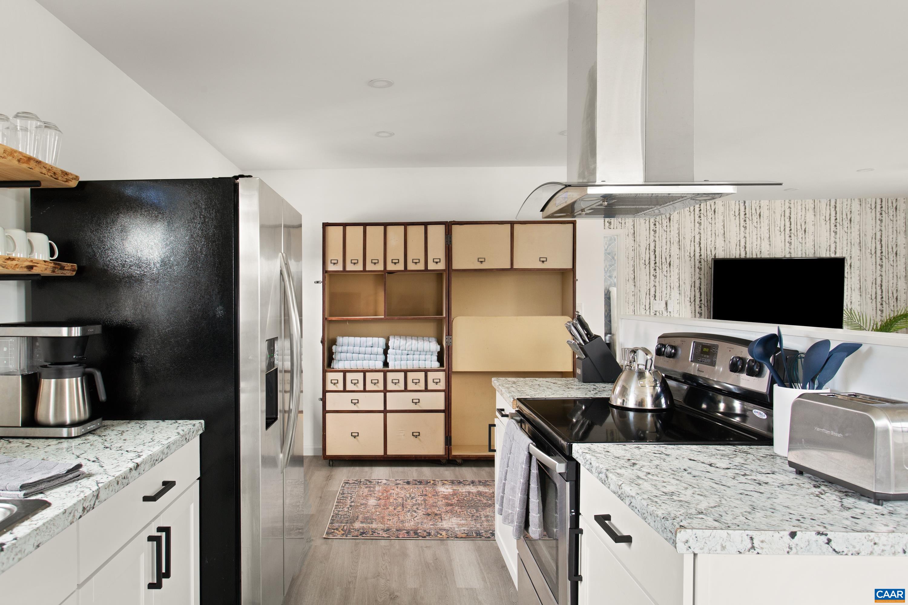 1795 Avon Road Afton, VA 22920 - Photo 12 of 39 a kitchen with granite countertop a stove and a sink