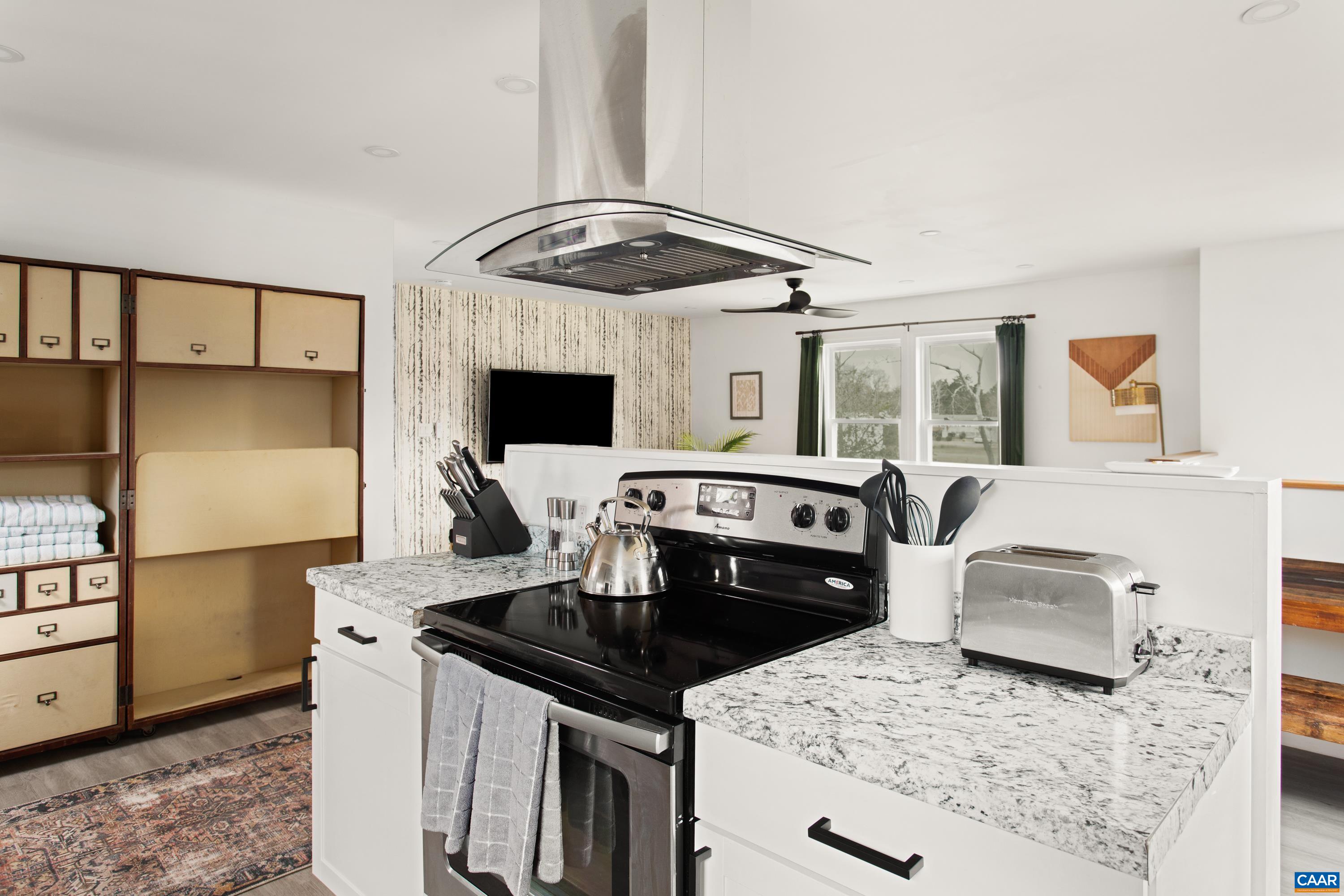 1795 Avon Road Afton, VA 22920 - Photo 13 of 39 a kitchen with granite countertop a stove and a refrigerator