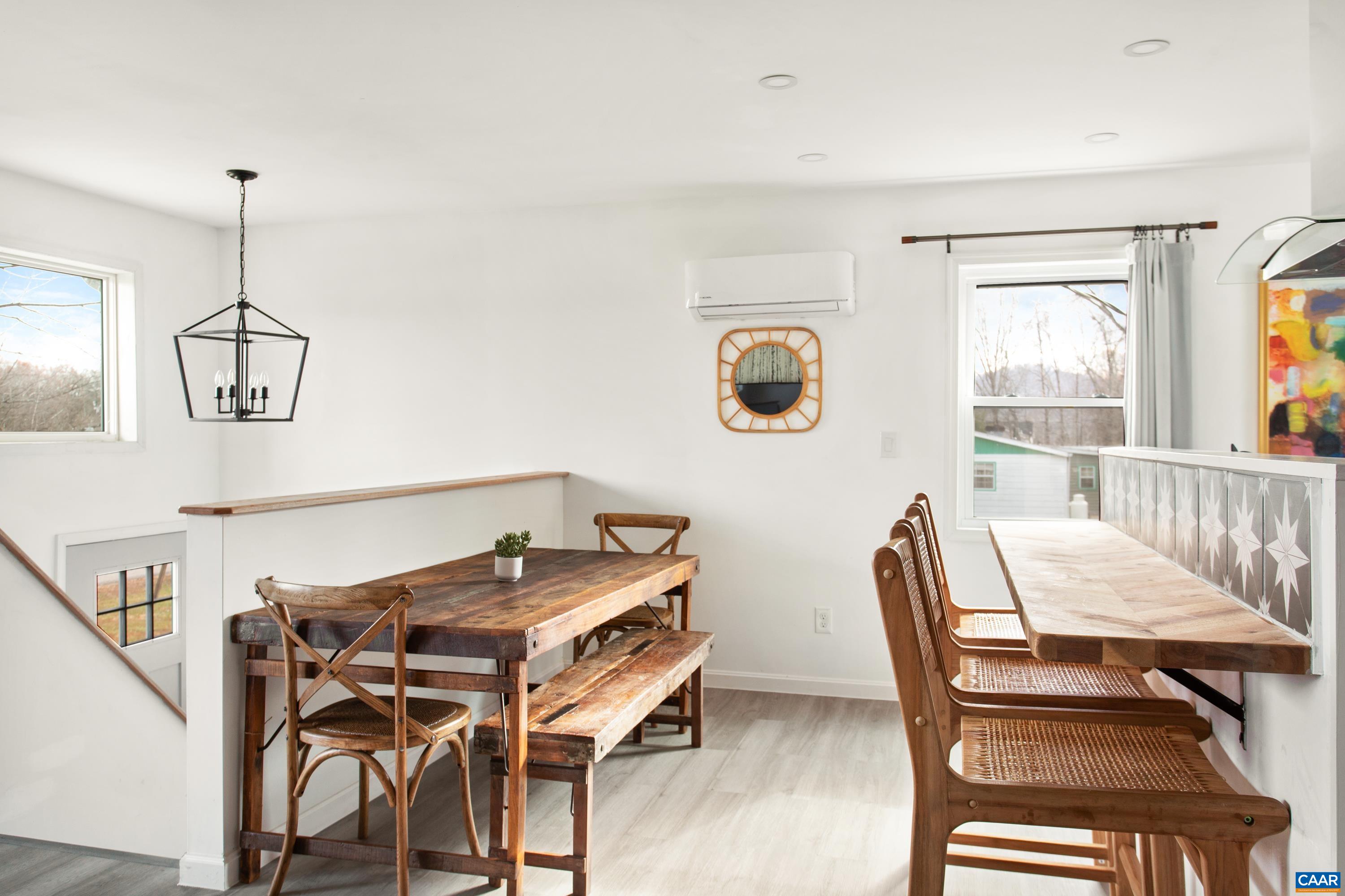1795 Avon Road Afton, VA 22920 - Photo 14 of 39 a view of a dining room with furniture window and wooden floor