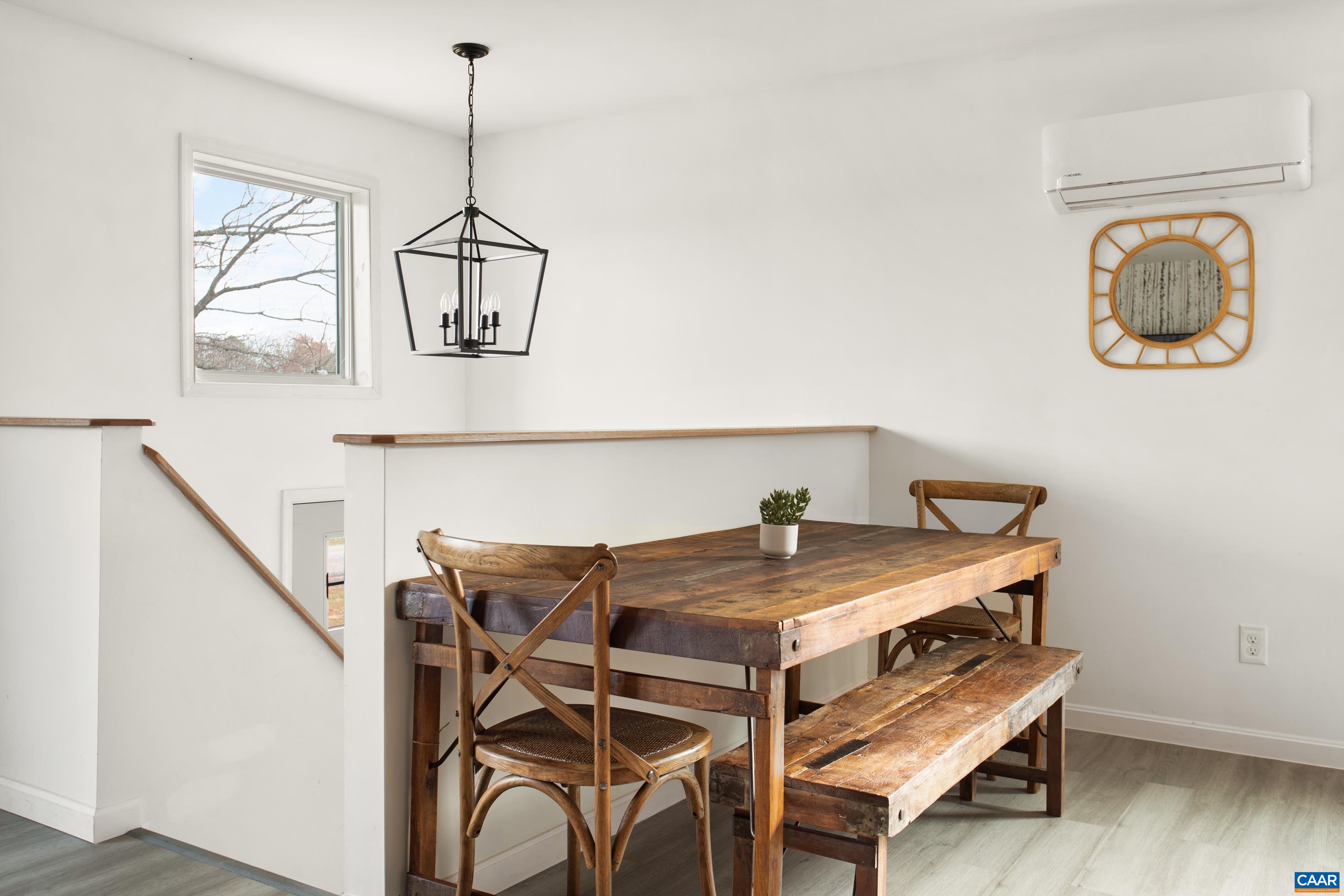 1795 Avon Road Afton, VA 22920 - Photo 15 of 39 a view of a dining room with furniture and wooden floor