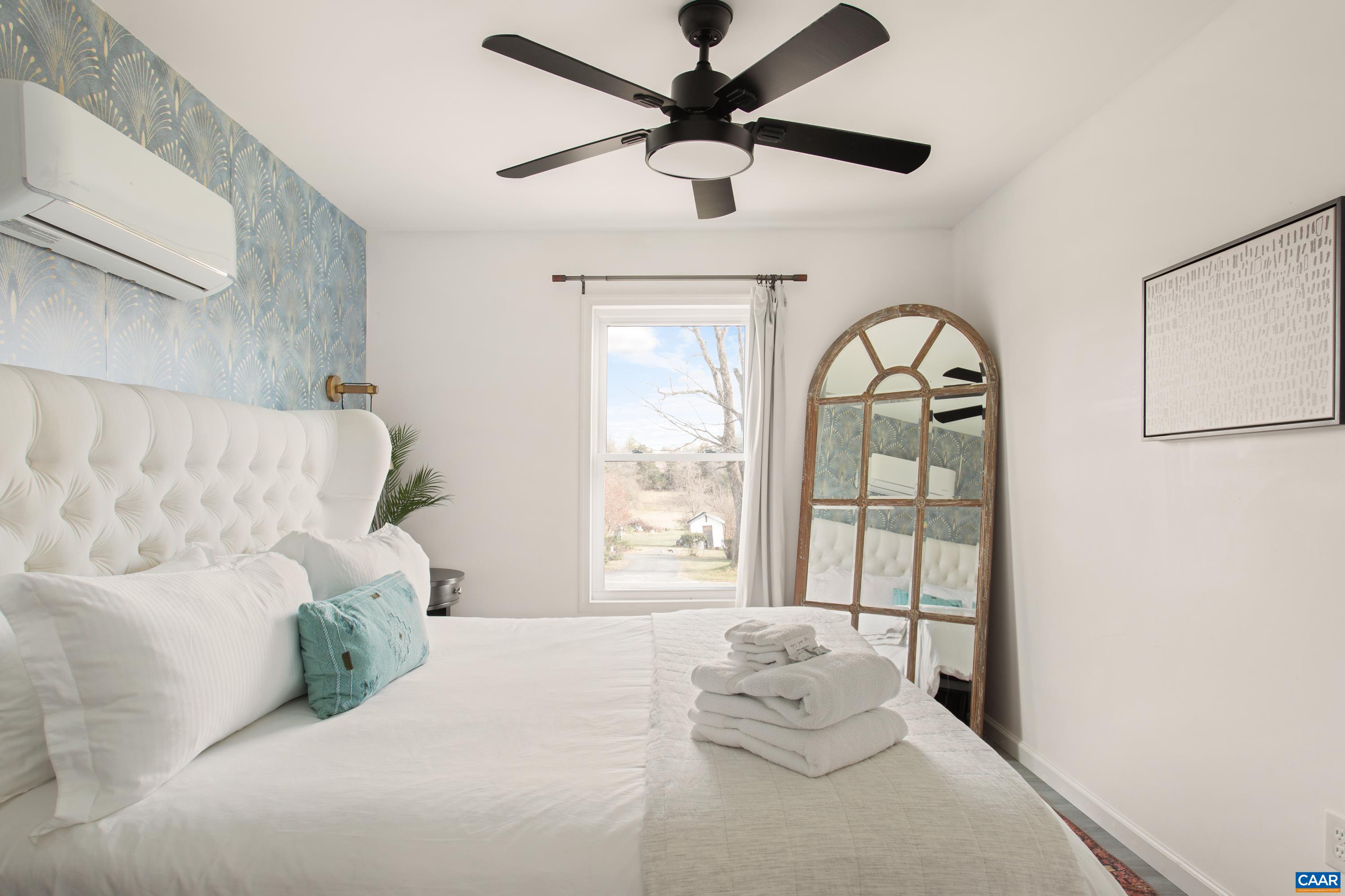 1795 Avon Road Afton, VA 22920 - Photo 18 of 39 a bedroom with a large bed and a window