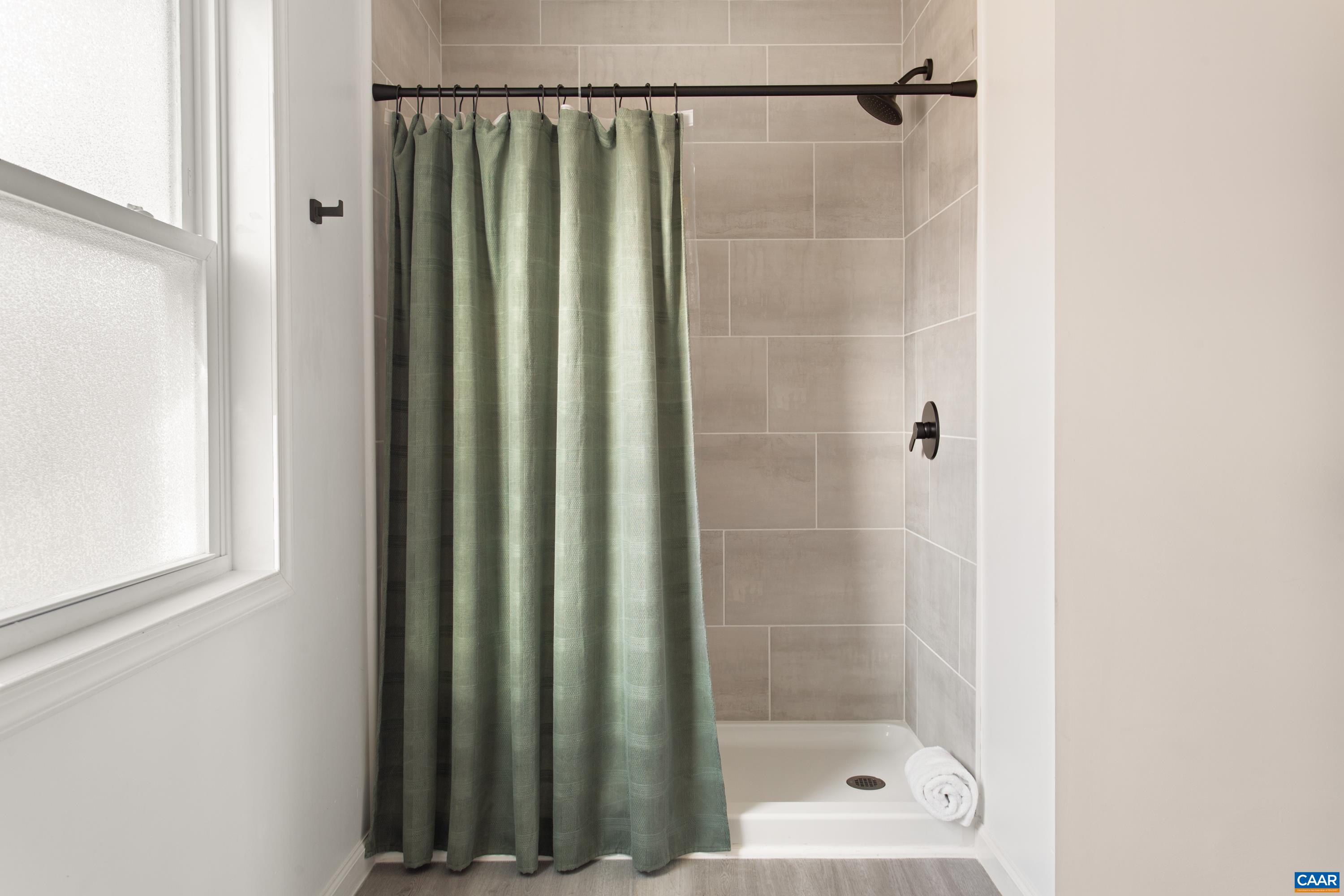 1795 Avon Road Afton, VA 22920 - Photo 21 of 39 a bathroom with a shower and a window