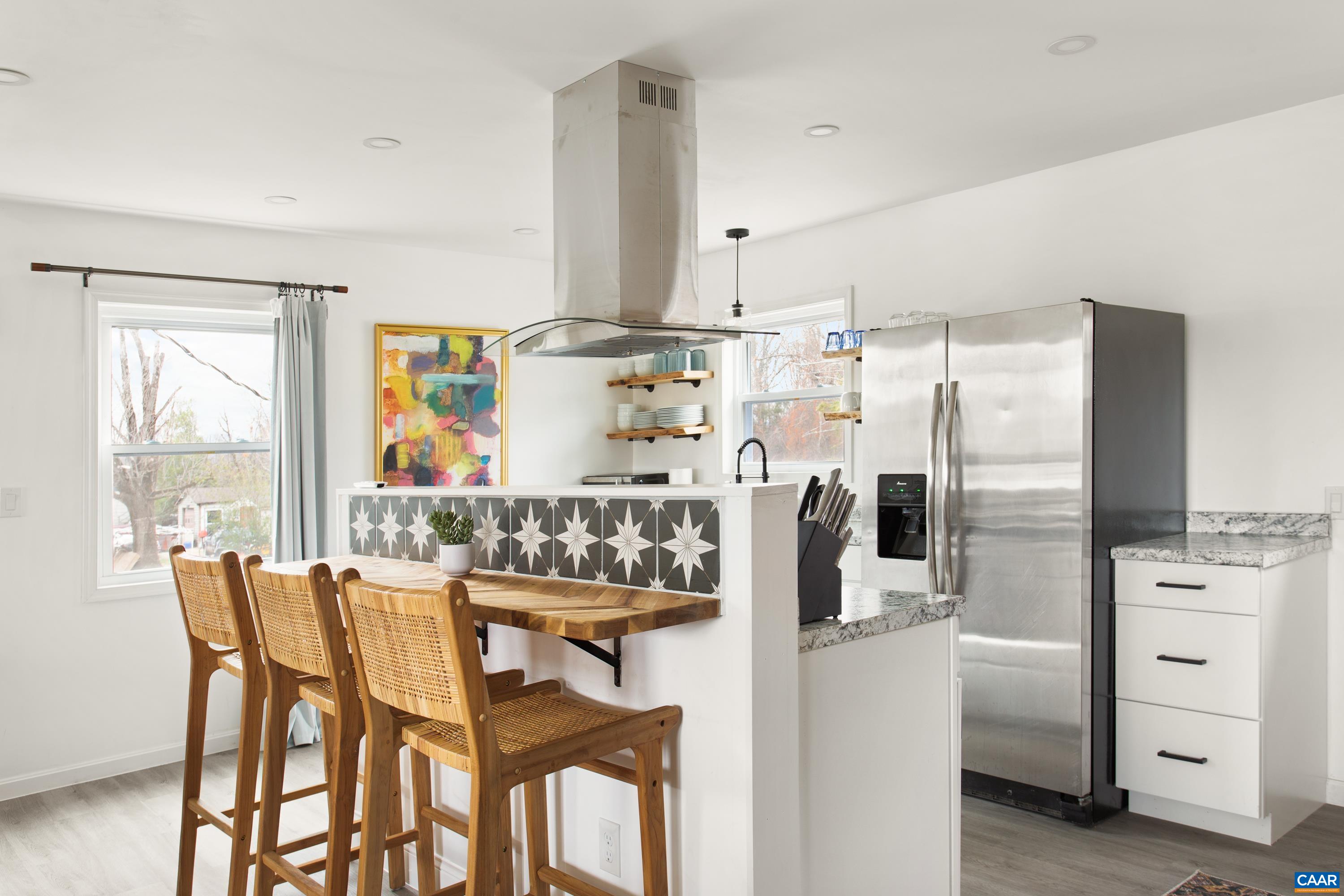 1795 Avon Road Afton, VA 22920 - Photo 8 of 39 a kitchen with white cabinets and stainless steel appliances