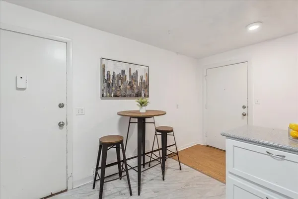 a view of a livingroom with furniture and wooden floor